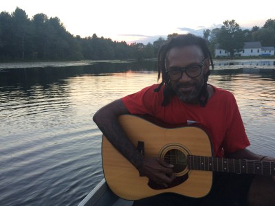 Joel chilling on the lake trying to learn guitar